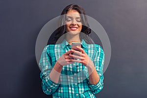 Attractive young woman with gadget