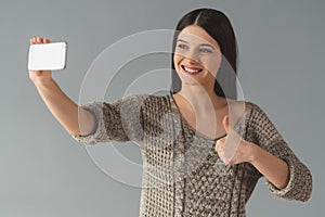 Attractive young woman with gadget