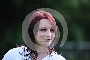 Attractive young woman with hair blown by wind