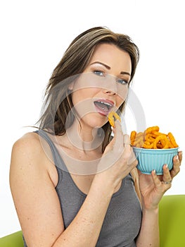 Attractive Young Woman Holding a Bowl of Onion Ring Flavoured Sn