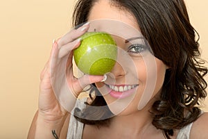 Attractive Young Woman Holding Fresh Ripe Juicy Green Apple