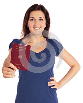 Attractive young woman holding a german passport