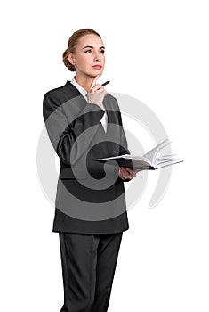 Attractive young woman is holding a notebook and pondering how to optimize business process to boost sales of the company.