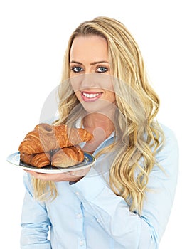 Attractive Young Woman Holding a Plate of Danish Pastries