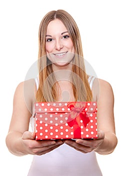 Attractive young woman holding present