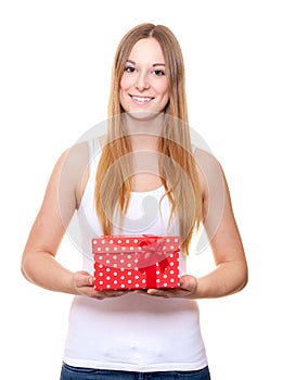 Attractive young woman holding present