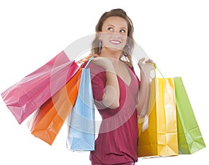 Attractive young woman holding several shoppingbag photo