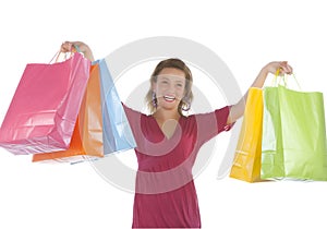 Attractive young woman holding several shoppingbag photo