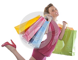 Attractive young woman holding several shoppingbag photo