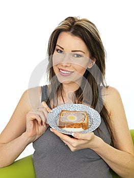 Attractive Young Woman Holding a Slice of Gala Pie