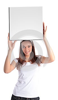 Attractive young woman holding white board