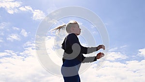 Attractive young woman, jumping up and down as exercise in real time, stock footage by Brian Holm Nielsen