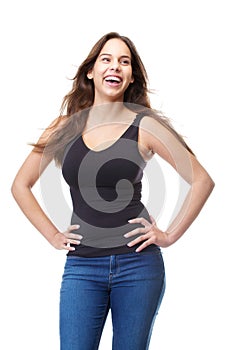 Attractive young woman laughing with hands on hips
