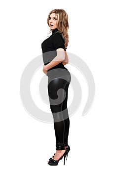 Attractive young woman in leggings. Isolated