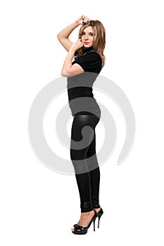 Attractive young woman in leggings. Isolated on white