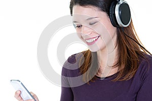 Attractive young woman listening to music on her mobile