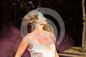 Attractive young woman with long hair fluttering on wind with pi