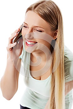 Attractive young woman making a phone call.