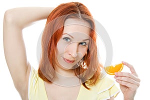 Attractive young woman with oranges