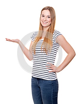Attractive young woman pointing to the side
