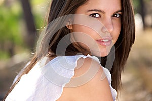 Attractive young woman posing outside in forest