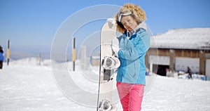 Attractive young woman posing at a ski resort