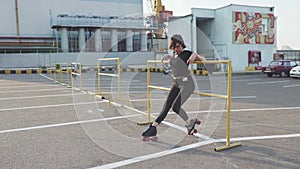 Attractive young woman with roller skating on the street, having fun timen at sunset