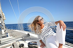 Attractive young woman on a sailing cruise