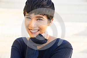 Attractive young woman with short stylish hair friendly smile