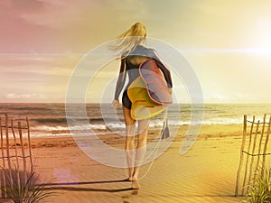 Attractive Young Woman In Short Wet Suit With Surf Board Walking Out To The Sea On A Sunny Beach
