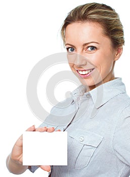 Attractive young woman showing empty blank paper card sign with copy space for text