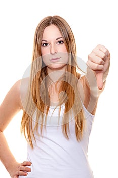 Attractive young woman showing thumbs down