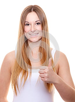 Attractive young woman showing thumbs up