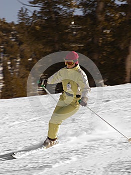 Attractive young woman skiing