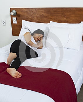 Attractive young woman sleeping well in bed