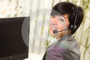 Attractive Young Woman Smiles Wearing Headset