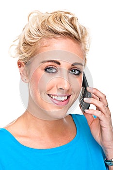 Attractive Young Woman Smiling while on Cell Phone
