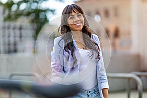 Attractive young woman smiling in the city