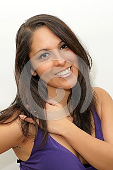 Attractive young woman smiling on isolated white background.