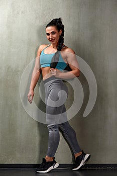 Attractive Young Woman Standing Strong In The Gym And Flexing Muscles - Beautiful Athletic Fitness Model Posing After