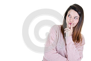 Attractive young woman standing thinking isolated looking side copy space empty