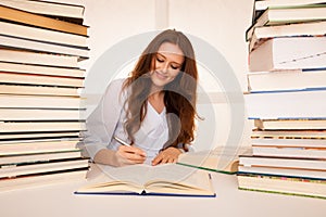 Attractive young woman student undre stress while studiing for e