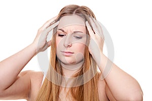 Attractive young woman suffers from headache