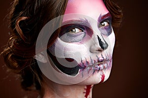 Attractive young woman with sugar skull makeup