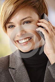 Attractive young woman talking on mobile phone