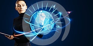 Attractive young woman using glowing futuristic blue globe hologram on blurry background. Digital innovation and technology