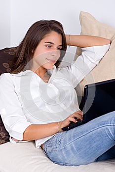 Attractive young woman using a laptop