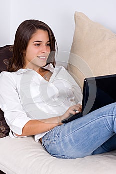 Attractive young woman using a laptop