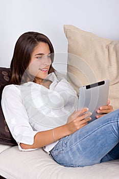 Attractive young woman using a tablet computer