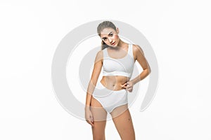 Attractive young woman in white underwear isolated on white background